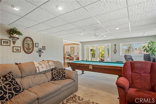 Family Room with glass doors leading out to the Patio and Backyard