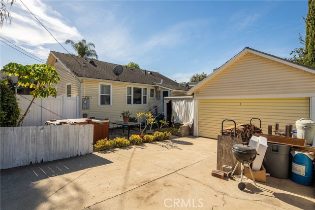 Driveway leading to garage and back door.