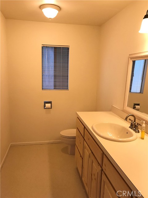 Half-bath off of bedroom #3 and family room