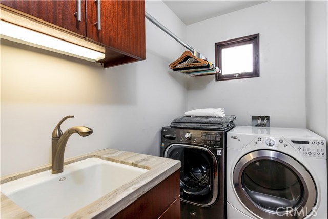 Laundry Room with sink and drying area