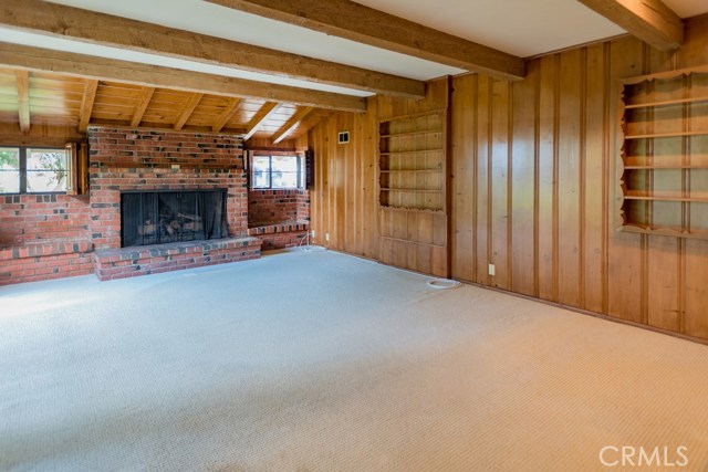 Family room with fireplace and paneling