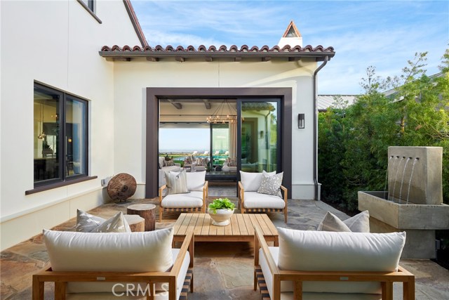 Private courtyard at the entry of this home opens to the great room and backyard. Model home shown.