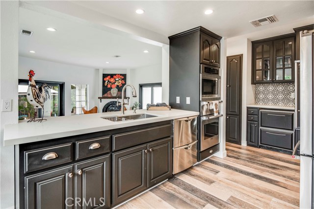 Kitchen has a pass through to the main family room