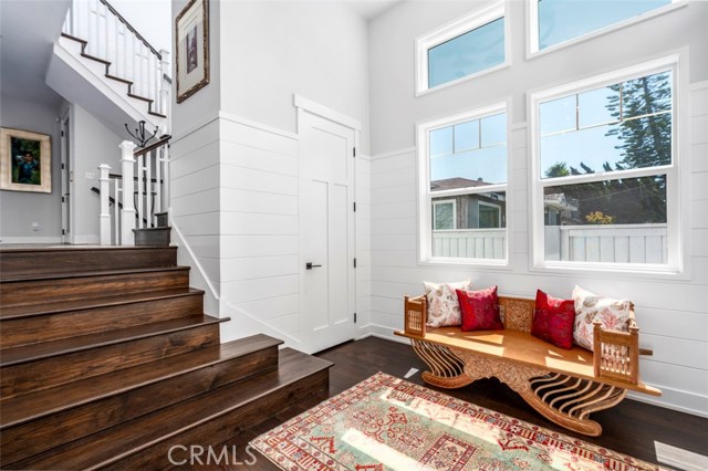Light filled formal entry & up a few steps to mid level with 3 bedrooms/2 baths