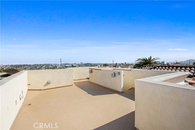 BEAUTIFUL LARGE ROOFTOP DECK.  SPEAKERS BUILT IN AND ROOM TO ADD A BUILT IN BARBEQUE