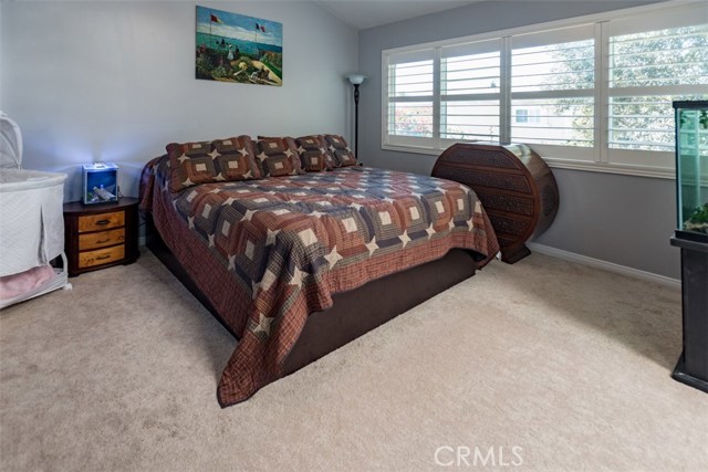 Master suite offers high ceilings and plenty of room. 2 sliding door closets - his and hers.