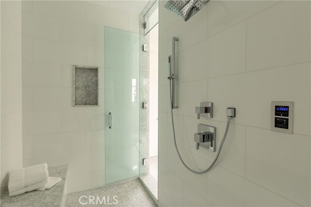 Huge steam shower with built-in bench and 2 separate glass doors