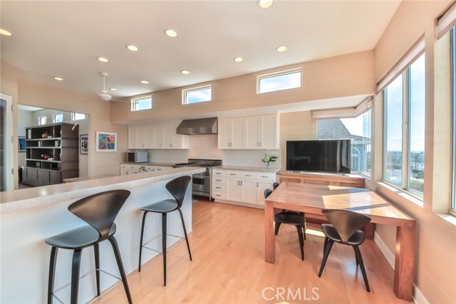 remodeled kitchen with new built-in seating area and new counters.