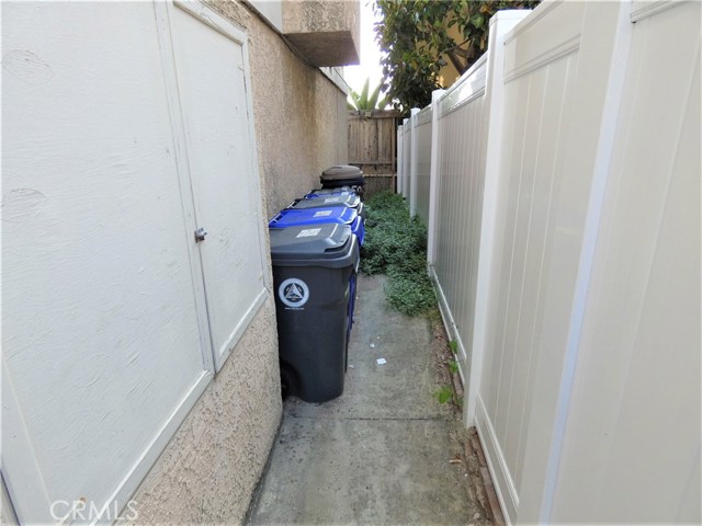 Newly installed No maintenance side yard fence with gate.
