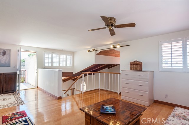 Big den on upper level could be an office, studio, Yoga studio or 6th bedroom?  The door opens to a small view deck landing and the spiral staircase that leads down to the tiled patio. 
This is a fantastic, sunny & breezy room with views!