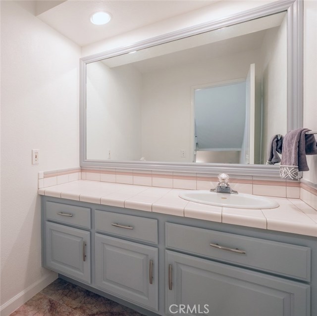 Guest Bath, custom cabinetry and mirror frame