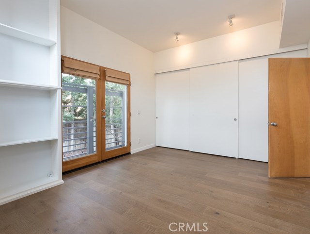 Wall-to-wall closet in lower back bedroom
