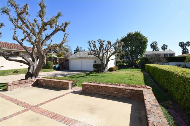 Backyard view - L shaped wrap around grass area