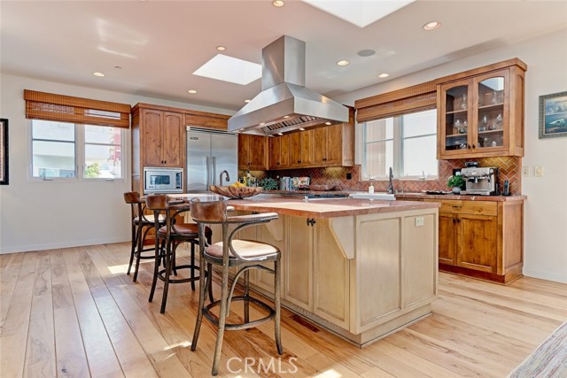 Spacious kitchen with beautiful wood cabinetry.