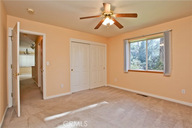 Bedroom one with ceiling fan and nice size closet