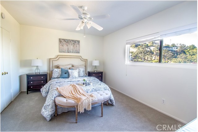 Master bedroom upstairs with city light, harbor and canyon views.