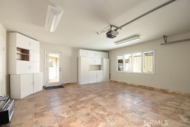 Garage with Tile Floors and Storage