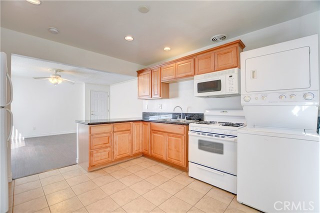 Unit B kitchen Stove, microwave, washer, dryer and refrigerator are all included.