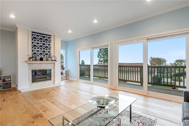Double sets of doors to the wrap-around balcony provide lots of light and huge city lights and mountain views.