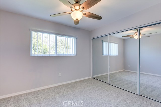 Bedroom 2 with mirrored glass doors