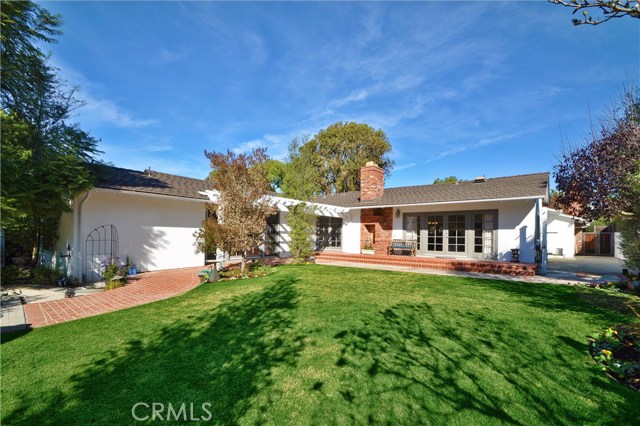 Private Brick Patio Overlooks Beautiful Yard and Garden