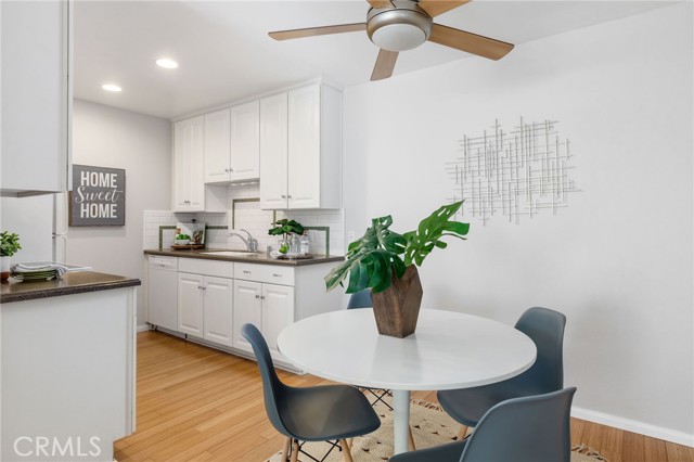 Bright Kitchen area with white cabinets.