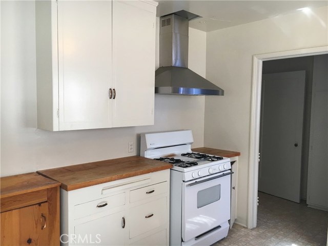 Kitchen and the door way to the laundry and the side entrance door.