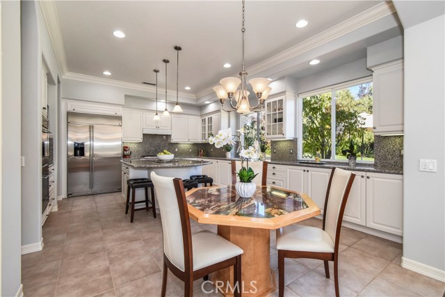 Gourmet kitchen and eat-in dining.