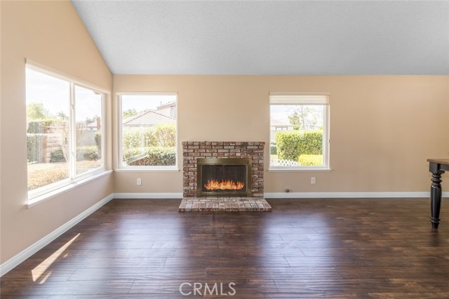 Great brick fireplace with plenty of windows making it nice and bright