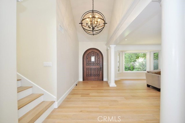 Foyer with Designer Wrought Iron Chandeliers