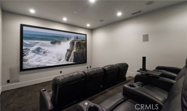 Home theater with 4K HDR Dolby Atmos 11 channel system installed. Recliners seats 8