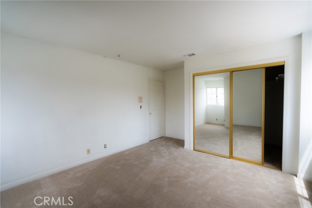 There’s a walk-in closet behind that mirrored door!