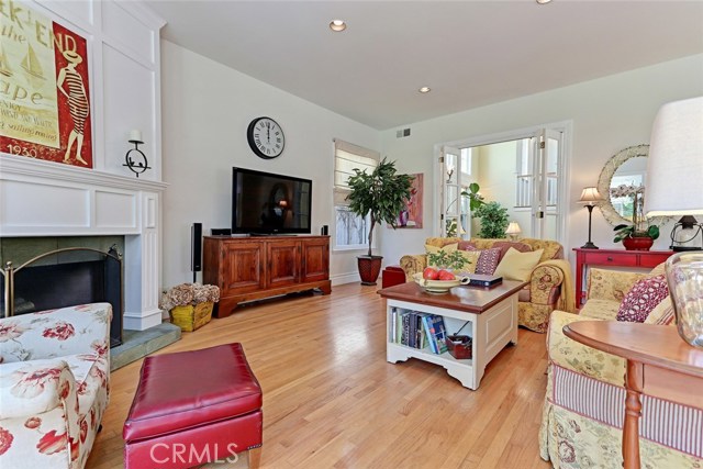 Fireplace with custom mantle makes the family room nice and cozy.