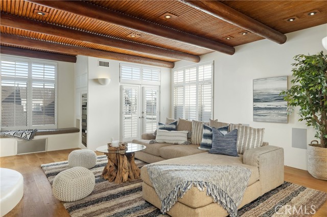 Living room with deck in second floor.
