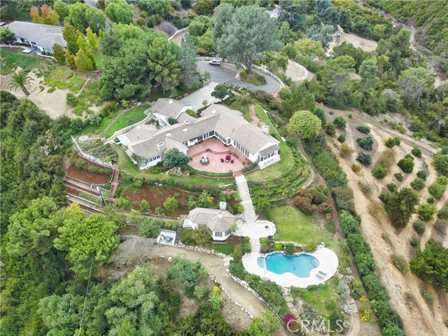 Upper Pad: View of patio, pool, pool house, and main house