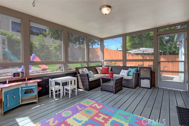 Large screened porch off of living Room and leading to backyard