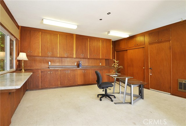 Bonus room with endless possibilities for use with built in closets, cabinets and storage space