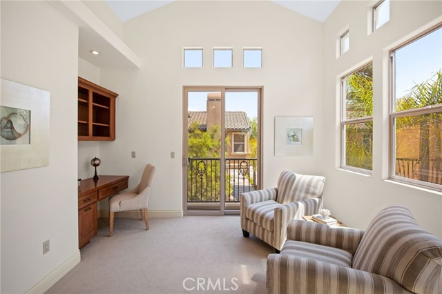 master bedroom with office and private balcony