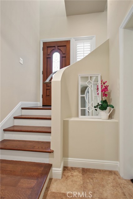 FIRST FLOOR FROM THE GARAGE STEPS UP TO THE FRONT DOOR