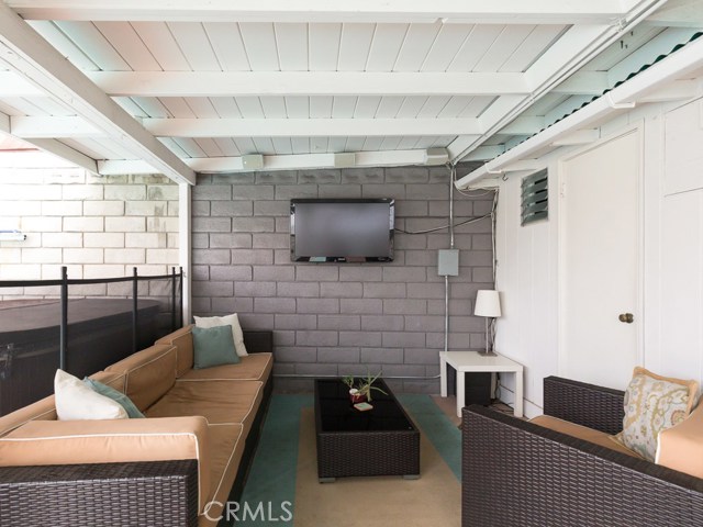 Outdoor lounging area next to Jacuzzi with a convenient extra 3/4 bath.