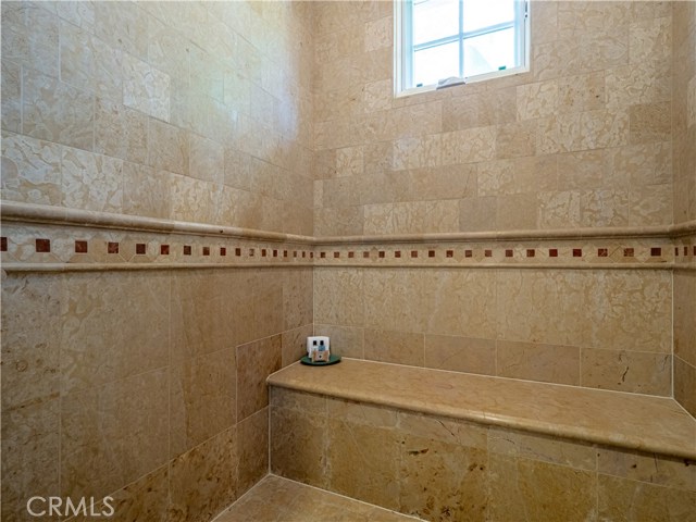 Oversized tile shower in the master bathroom.