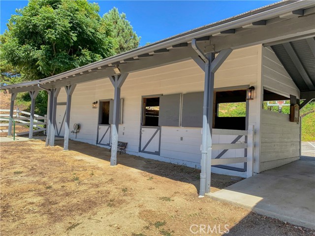 The barn has 3 stalls and a large tack room and is ready for horses!