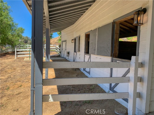 There is an existing fenced turnout with a water to it and room to do additional fenced runs on the barn level. Really an ideal horse property.