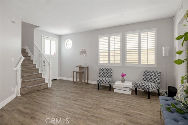 Front living room entrance and staircase to upstairs Front living room entrance and staircase to upstairs
