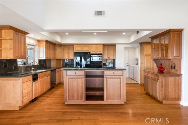 Granite counters, lots of storage, built-ins and separate pantry with pull out shelves.