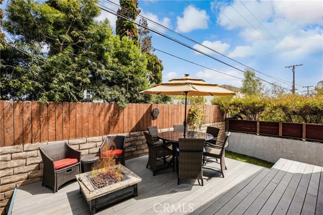 Private rear deck, gas fire pit and BBQ connections, steps down to north and south sideyards