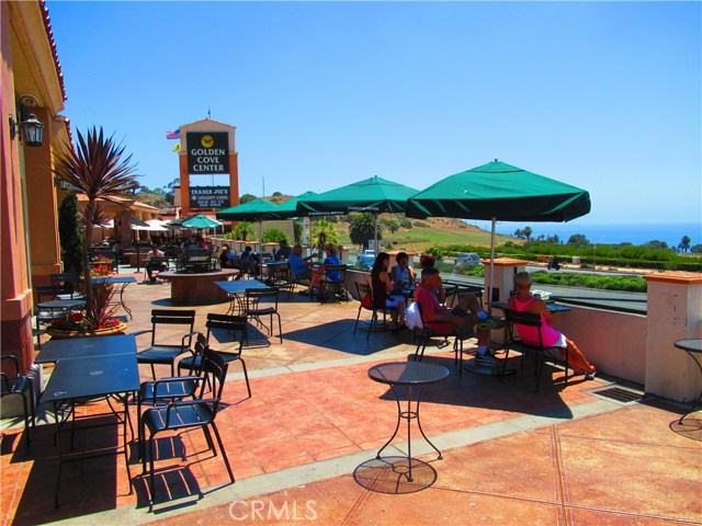 Resort Living - Inside Outside Dining while enjoying Ocean and Sunset views or just to spend a lazy afternoon watching cyclists as they travel by.