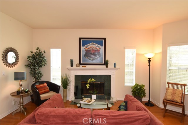 Beautiful marble fireplace with mantle in the living room.  Room is larger than this photo appears!