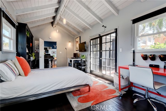 Main floor spacious bedroom with french doors leading to the private garden.