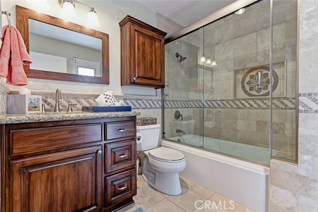 Remodeled guest bathroom with direct access to backyard and jacuzzi.